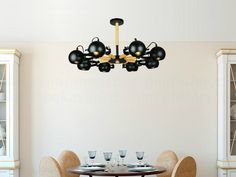 a dining room table with chairs and a chandelier hanging from it's ceiling