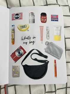 an open notebook with various items on it and the words what's in my bag