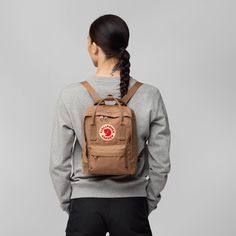 Behold the Fjällräven Kånken Mini: a tiny titan of style and convenience that's ready to revolutionize your everyday carry game! Picture this mini marvel as your trusty sidekick, always by your side as you navigate the bustling city streets or wander through tranquil nature trails. With its charming design and extremely practical features, the Kånken Mini is more than just a bag – it's a statement piece that adds a touch of whimsy to your daily adventures.Step into the world of fun and functionality with the Fjällräven Kånken Mini – the little bag with big personality! From its compact size to its durable construction, every aspect of this mini masterpiece is designed to make your life easier and your style brighter. Whether you're running errands around town or exploring the great outdoor Fjallraven Kanken Mini, Trekking Jacket, Save The Arctic, Hunting Backpacks, Popular Backpacks, Kanken Mini, Fjällräven Kånken, Small Travel Bag, Laptop Shoulder Bag