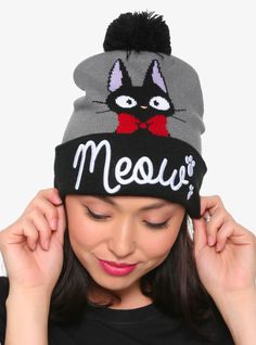 The Detail Look, Kiki! It's me! Everyone needs a worried black cat to keep them company, what would be more convenient than carrying him on your head? This super soft Jiji hat has paw prints and "Meow" embroidered on the front and a black pom on the top. Purrfect! 100% Acrylic One size fits most Imported Black Novelty Beanie Hat, Novelty Black Beanie Hat, Black Cat Ears Hat With Cat Design, Black Hat With Cat Ears And Cat Design, Black Cat Design Hat With Cat Ears, Adjustable Black Hat With Cat Design, Black Adjustable Harajuku Hat, Black Adjustable Harajuku Style Hat, Adjustable Black Harajuku Style Hat