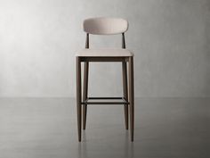 an upholstered bar stool with a white seat and backrest, against a gray background