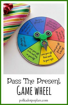 a game wheel with the words pass the present on it and an image of a piece of paper