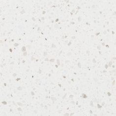 a white counter top with small speckles on it