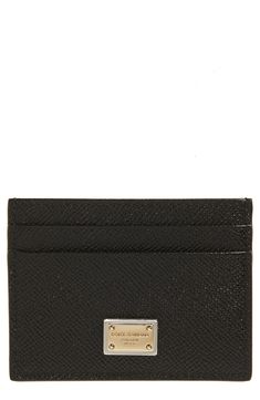 Carry your cards and currency in the contemporary-luxe style of this Italian-calfskin card holder detailed with a gleaming brand-engraved placard. Four card slots; slip pocket Leather Made in Italy Designer Handbags Black Rectangular Card Holder With Logo Plaque, Black Luxury Card Holder With Engraved Logo, Luxury Black Card Holder With Engraved Logo, Designer Leather Card Holder With Logo, Classic Black Card Holder With Logo Plaque, Luxury Leather Wallet With Silver-tone Logo, Modern Rectangular Card Holder With Logo Plaque, Designer Card Holder With Logo Plaque For Formal Events, Designer Formal Card Holder With Logo Plaque