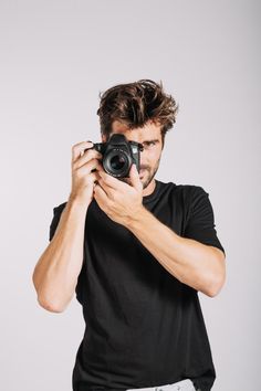 a man taking a photo with his camera