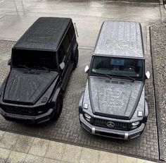 two cars parked next to each other on the street