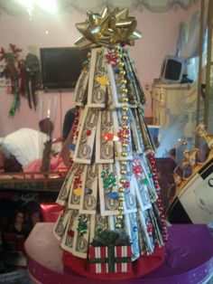 a christmas tree made out of dollar bills