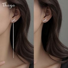 Experience the unique design of Thaya's Silver Cross-shaped Earrings for Women. Made from high-quality 925 silver metal material and designed with a stunning cross pattern, these earrings are both elegant and sophisticated. With a focus on female gender and an overall length of about 12cm and cross size of 10*17mm, they are perfect for any occasion. Elevate your style with Thaya's stunning Silver Cross-shaped Earrings. White Gold Cross Earrings For Pierced Ears, Elegant Hypoallergenic Cross-shaped Earrings, Elegant Hypoallergenic Cross Earrings, Elegant Pierced Cross Jewelry, Elegant Pierced Cross Earrings, Minimalist Silver Cross Earrings, Elegant Silver Pierced Threader Earrings, Silver Tassel Earrings, Cross Patterns