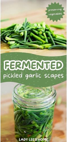 a jar filled with pickled garlic on top of a wooden table next to green beans