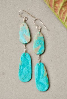 Native American double slab earring by artist Ronald Chavez Beautiful turquoise earrings with double slab. Gorgeous blue tones and soft matrix. Great pair of earrings by the talented Santo Domingo artist Ronald Chavez. Measurements : top slab : 1" X 0.5" bottom slab : 1 3/8" X 5/8" total length : 2 13/16" sterling silver turquoise Artsy Turquoise Nickel-free Earrings, Artsy Nickel-free Turquoise Earrings, Artsy Turquoise Nickel-free Jewelry, Artistic Turquoise Jewelry With Matching Earrings, Native American Jewelry, Blue Tones, Turquoise Earrings, Silver Turquoise, Turquoise Sterling Silver