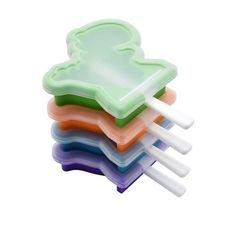 four plastic forks stacked on top of each other in different colors and shapes, with one fork sticking out of the middle