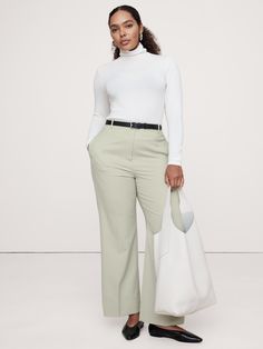 We cut this pant for a sleek and sharply-tailored fit, opting for a barely-there Hollywood waistband and darts at the back waist to create a clean look that's also ultra-comfortable.  For fabric, we reached for our Siena Italian wool—a customer favorite for its all-weather weight and hint of stretch.  High Rise Modern Straight: High rise (12") with a relaxed fit through the thighs and a straight leg.  Full length.  Fabric from Italy's Marzotto mill.  Responsible Wool Standard Certified: This glo Chic Straight Leg Dress Pants With Minimal Stretch, Spring Workwear Pants With Minimal Stretch, Chic Dress Pants With Minimal Stretch For Business Casual, Chic Dress Pants For Business Casual, Chic Straight Dress Pants, Chic Bottoms With Minimal Stretch For Spring, The Sheep, Wool Pants, Straight Pants