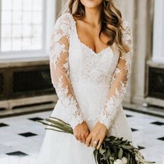 a woman in a wedding dress holding a bouquet