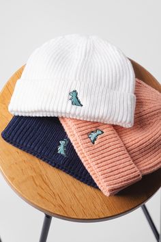 Embroidered little dino design on our soft, thick knit beanies. Premium embroidery threads with 8 unique pastel colours of hats available to choose from. Whether buying for yourself or as a gift, it is an excellent choice that is sure to make a statement. Makes a great gift for friend, family or even yourself. The must have wardrobe classic! All of our items are made in Britain in our London studio & are made to order, only when you place an order. Never mass produced. ✅ DETAILS ✅ Product Type: Trendy White Knit Hat, Cozy Cotton Knitted Hats, Warm White Crochet Hat Casual Style, White Cotton Hats For Cold Weather, Knitted Cotton Hats For Cold Weather, Knitted Cotton Cap, Cozy Cotton Soft Knit Hats, Cozy Knitted Cotton Hats, Casual White Knitted Beanie