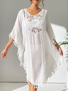 Casual V-neck Cover-up With Tassels, Casual V-neck Tassel Cover-up, Short Sleeve Beach Dress With Tassels, Beach Dresses With Short Sleeves And Tassels, White Summer Dress With Tassel Ties, Beach Dresses With Tassels And Short Sleeves, V-neck Tassel Dress For Beach Season, V-neck Dresses With Tassels For Beach Season, Summer White Dresses With Tassel Ties