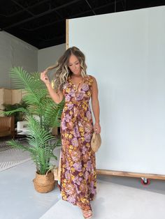 Details Deep V-Neckline Floral Maxi Dress with Chest Strings and Open Side Detailing Lined Color: Brown Multi Material: 100% Polyester Size Runs True to Size Model is Wearing a Size Small Model Measurements Size: 4 Height: 5'2" Weight: 135lbs Bust: 35" Waist: 26" Hips: 35" Bra Size: 34C Brown Floral Print V-neck Dress, Brown V-neck Summer Maxi Dress, Brown V-neck Maxi Dress, Summer Brown V-neck Maxi Dress, Brown V-neck Beach Dress, Brown V-neck Maxi Dress For Beach, Sleeveless Printed Brown Maxi Dress, Brown Sleeveless Printed Maxi Dress, Brown Floral Print Maxi Dress For Vacation