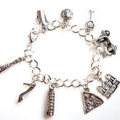 This charm bracelet features Italy/Italian inspired Tibetan silver charm. The charms are attached to a silver tone 7.5 inches chain bracelet Laura Howard, Food Rings, Miniature Food Jewelry, Bunny Earrings, Fancy Rings, Food Jewelry, Silver Charm Bracelet, Italian Charm Bracelet, Tibet