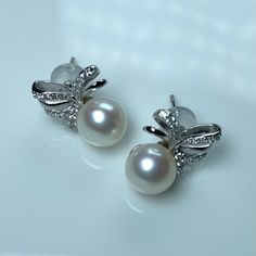 Pearls: freshwater  Shape: round Luster: mirror Grade: AAAAA Size: 7.5-8.5 Color: white with touch of pink Nacre: cored. Thick nacre. Stud: white/yellow gold plated 925 silver Pearl Earrings For Evening, Pearl White Akoya Pearl Earrings For Evening, Akoya Pearl White Pearl Earrings For Evening, Evening Akoya Pearl Earrings In Pearl White, Pear-shaped Akoya Pearl Silver Earrings, Evening Akoya Pearl White Pearl Earrings, Akoya Pearl Drop Earrings In Pearl White, Silver Akoya Pearl Earrings With Pearl Charm, Round Pearl Earrings As Gift