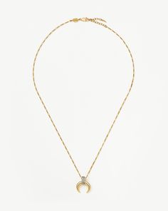 Lucy Williams Pavé Horn Pendant Necklace | 18ct Gold Plated Vermeil/Cubic Zirconia. A Classic, Reimagined. Inspired by Our Original Lucy Williams X Missoma Trendsetting Design, the Large Horn Pendant Features Cubic Zirconia Snow Pavé for a Fine-Style Jewelry Finish, Paired with a Mini Figaro Chain. Style with a Classic Choker for a Layered Look. Metal: 18Ct Recycled Gold Plated Vermeil on Recycled Sterling Silver Pendant Dimensions: 16. 6mm X 17mm Length: 500mm Gemstone: Cubic Zirconia Weight: 7 Luxury Gold-plated Necklaces With Pave Setting, Luxury Gold-plated Necklace With Pave Setting, Luxury White Gold Tarnish-resistant Diamond Necklace, Refined Yellow Gold Necklace With Cubic Zirconia, Elegant Tarnish Resistant Diamond Necklace For Anniversary, Luxury Tarnish Resistant Cubic Zirconia Necklaces, Luxury Tarnish-resistant Cubic Zirconia Necklace, Luxury Tarnish Resistant Cubic Zirconia Necklace, Gold Necklaces With Pave Setting For Everyday Luxury