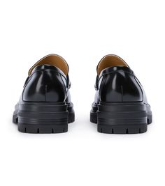 Stand-out from the crowd with our Wiz loafer. Showcasing a shiny black leather exterior, this design features an exaggerated chunky sole with a sleek rounded toe-shape, a high-cut vamp and is finished with a leather upper, lining and cushioned foot-bed. -Material: Leather Upper & Lining -Sole: Man-Made -Fit: We recommend choosing a half size down -Toe-shape: Rounded -Features: Chunky sole -Heel: 4.5cm Black Vibram Sole Platform Loafers For Business, Black Business Platform Loafers With Vibram Sole, Classic Black Platform Loafers With Contrast Sole, Black Leather Platform Loafers With Vibram Sole, Business Platform Slip-on Loafers With Vibram Sole, Modern Black Platform Loafers With Lug Sole, Black Leather Platform Loafers With Lug Sole, Modern Formal Platform Loafers With Contrast Sole, Black Leather Platform Loafers With Chunky Platform