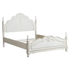 a white bed frame with an ornate headboard and foot board on the bottom end