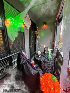 a decorated porch with halloween decorations and lights