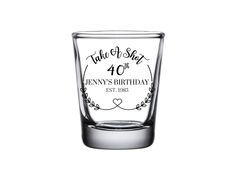 a shot glass with the number fortyth birthday written on it and an arrow in the middle