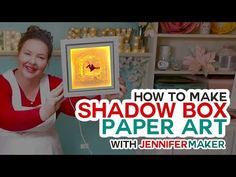 a woman holding up a shadow box in front of her face with the words, how to make shadow box paper art