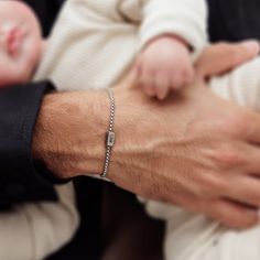 "Introducing our exquisite custom silver bracelet, designed with love for the most important man in your life, Dad. This bracelet is adorned with the names of your precious kids, making it a cherished keepsake he will proudly wear and show off to everyone he meets. Handcrafted with utmost attention to detail, each bracelet is made from high-quality stainless steel, ensuring durability and longevity. The personalized touch adds a heartfelt and sentimental element, making this piece a truly unique and meaningful gift for any occasion. Whether it's Father's Day or his birthday, this custom bracelet is the perfect way to honor the bond between a father and his little ones. Order now and give Dad a gift he will treasure forever. Material: Stainless steel. Bracelet length: 7\" (18 cm) + 1.18\" ( Minimalist Silver Bracelets For Father's Day, Silver Chain Bracelet For Father's Day, Engraved Sterling Silver Beaded Bracelet As Gift, Engraved Sterling Silver Beaded Bracelets As Gift, Silver Bracelets For Father's Day Gift, Elegant Silver Bracelets For Father's Day, Silver Name Bracelet For Father's Day Anniversary, Silver Name Bracelet With Jubilee Design For Personalized Gift, Gift Sterling Silver Bracelet With Box Chain