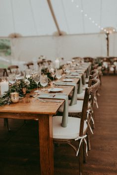 the tables are set with candles and place settings for guests to sit down at them