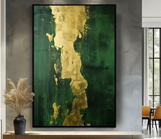 a large green and gold painting in a living room