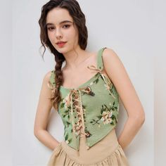 Floral Pattern Top With Crisscross Ribbon On The Front. I Have Four Dogs At Home. Casual Cross-tied Tops For The Beach, Casual Cross-tied Top For Summer, Casual Cross-tied Tops For Spring, Chic Cross-tied Crop Top For Spring, Casual Sleeveless Cross-tied Tops, Spring Fitted Cross-tied Tops, Trendy Cross-tied Top For Spring, Trendy Cross-tied Tops For Summer, Summer Cross-tied Crop Top