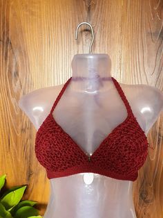 A handmade crochet bikini top. Its is made of cotton threads with an intricate design. It can be worn with a saree, Skirt or just casual beachwear bikini. Bust Size- 30/32" Occassion- Beach wear, summer wear, beach wear, It can be Custom made on order to preference for color and size. Crochet Lace Triangle Halter Top For Festival, Fitted Triangle Crochet Top For Vacation, Fitted Halter Neck Crochet Top For Beach, Beach Crochet Lace Stretch Crop Top, Handmade Fitted Triangle Halter Top, Fitted Hand Knitted Tops For The Beach, Beachwear Crochet Triangle Halter Top, Stretch Crochet Lace Top For Beach, Triangle Crochet Top For Beach Season