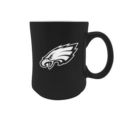 a black mug with the philadelphia eagles logo on it