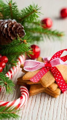 christmas cookies and candy canes on a table