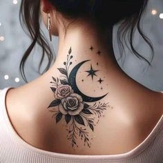 a woman's back neck with a flower and crescent tattoo on the upper part