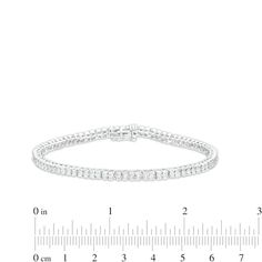 Wrap your wrist in a classic and shimmering style with this diamond tennis bracelet in sterling silver. Crafted in sterling silver Each diamond in this continuous line is artfully set to enhance size and sparkle. Radiant with 1/4 ct. t.w. of diamonds This 7.25-inch bracelet secures with a box clasp. Classic Silver Channel Set Diamond Bracelet, Elegant White Gold Tennis Bracelet With Channel Set, Elegant White Gold Tennis Bracelet Channel Set, Elegant Silver Channel Set Tennis Bracelet, Elegant Silver Tennis Bracelet With Channel Set, White Gold Channel Set Tennis Bracelet For Anniversary, Elegant Silver Tennis Bracelet Channel Set, Silver Channel Set Tennis Bracelet, Classic Silver Tennis Bracelet With Channel Set