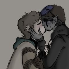 two people that are kissing each other in front of a gray background and one is wearing a hoodie