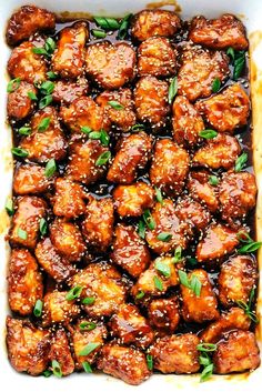 an overhead view of chicken wings with sauce in a casserole dish