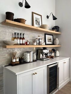 a kitchen with open shelving and shelves on the wall