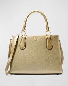 MICHAEL Michael Kors "Marilyn" satchel bag in metallic leather     Rolled top handles, 4.5" drop    Detachable, adjustable shoulder strap    Can be worn as a top handle or shoulder bag     Center zip compartment divides interior; one slip pocket and one zip pocket     Feet protect bottom of bag     Approx. 8.3"H x 11.3"W x 5.5"D    Imported High-end Gold Top Handle Bag, High-end Gold Bag With Top Carry Handle, High-end Gold Bags With Top Carry Handle, Designer Gold Satchel With Detachable Strap, High-end Gold Rectangular Satchel, Luxury Gold Satchel With Top Carry Handle, Luxury Metallic Bags For Shopping, Designer Gold Top Handle Satchel, Modern Metallic Double Handle Bag