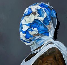 a painting of a woman's back with blue and white flowers on her head