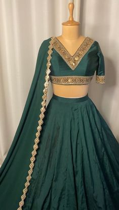 Emerald green lehenga set included dupatta, blouse and lehenga. Composition & Material: Georgette dupatta with raw silk lehenga and blouse in emerald green color. Sizing: Once your order is placed we will send you an email or WhatsApp regarding all the measurements that are required for your custom made outfit for the best fit. Delivery: This piece will take 4-6 weeks for production and delivery, time starts after we have received your sizing. If you require this earlier, please inquire prior to Green Lahanga Design Latest, Green Lehenga Blouse Designs, Green Choli Lehenga, Green Lehenga Simple, Long Sleeves Lehenga, Emerald Green Lengha, Green Lehenga Designs, Dark Green Dupatta, Light Green Lehenga