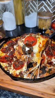 a pizza sitting on top of a wooden cutting board