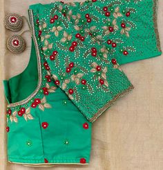 Expertly crafted with traditional Maggam and Aari work, this Princess Cut Padded blouse is the perfect complement to your silk saree or lehenga. Adjustable margin 36”-42”, it adds a touch of elegance and sophistication to your outfit. Dry clean only Semi-stitched Dola Silk Blouse Piece, Green Blouse With Resham Embroidery For Puja, Unstitched Blouse For Reception With Cutdana Details, Unstitched Dola Silk Blouse Piece For Reception, Unstitched Blouse For Reception With Cutdana, Designer Multicolor Embroidered Blouse Piece With Unstitched Blouse, Unstitched Blouse With Multicolor Embroidery For Diwali, Multicolor Embroidered Unstitched Blouse For Diwali, Designer Multicolor Embroidered Unstitched Blouse Piece