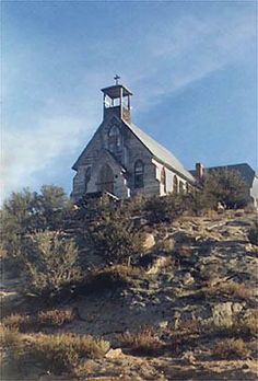 an old church on top of a hill