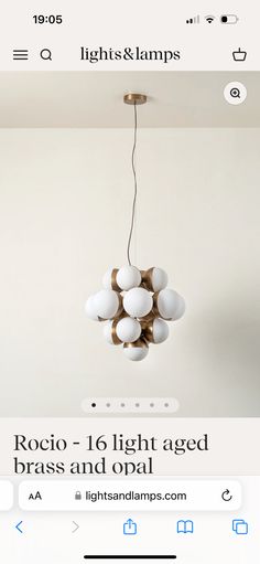 an image of a chandelier that is hanging from the ceiling with lights and lamps on it