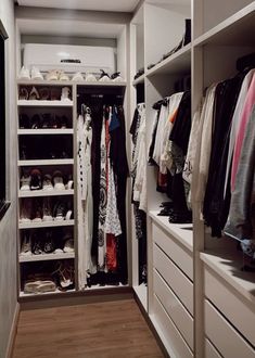 the closet is full of shoes and clothes