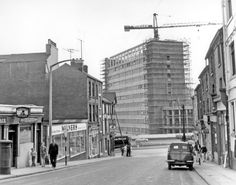 an old black and white photo of a city street