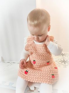 Gorgeous strawberry crochet dress, available in sizes newborn to 5 years. Made out of super soft acrylic yarn and it's nice and light so it won't get too hot in the warmer months.  Machine washable, do not tumble dry. Cute Pink Knitted Dress, Cute Hand Knitted Cotton Dresses, Hand Knitted Cotton Dresses In Cute Style, Hand Knitted Cute Cotton Dresses, Hand-knitted Cotton Dresses In Cute Style, Cute Cotton Crochet Dress For Spring, Cute Fitted Crochet Cotton Dress, Fitted Crochet Cotton Dress In Cute Style, Cute Handmade Spring Dress